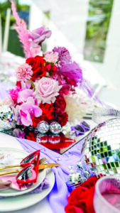 Fun disco ball and silk flower table centrepiece